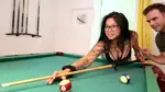 Kim learns to hold a pool cue